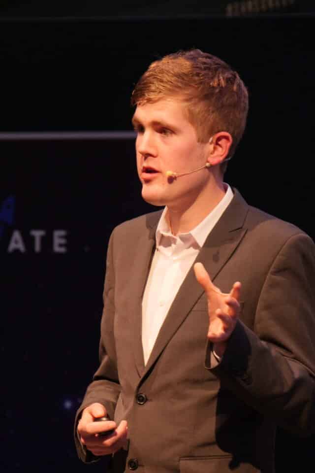 Alex Staniforth, motivational speaker looking at camera