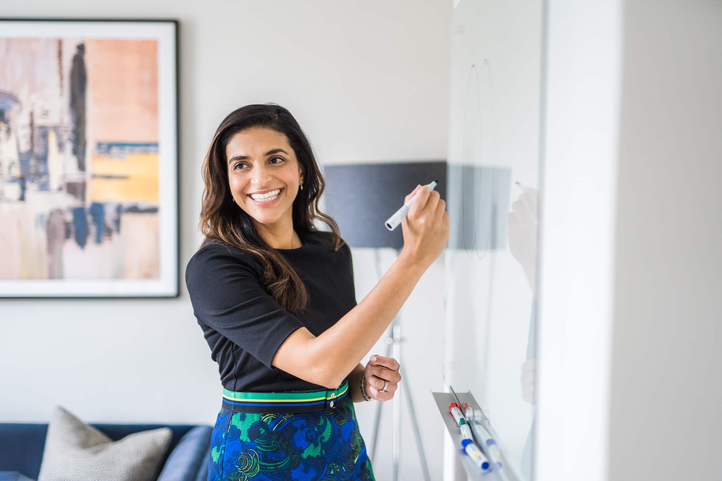 Abigail Ireland keynote speaker writing on a whiteboard